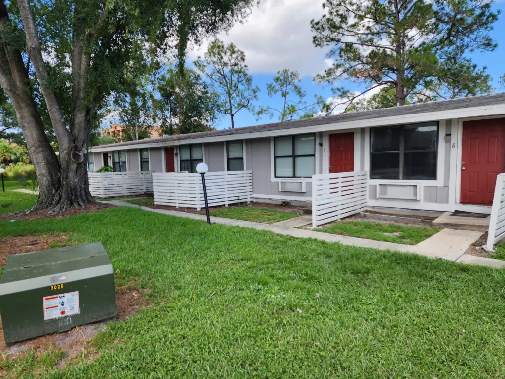 Single-story Heatherwood apartment homes with private red doors