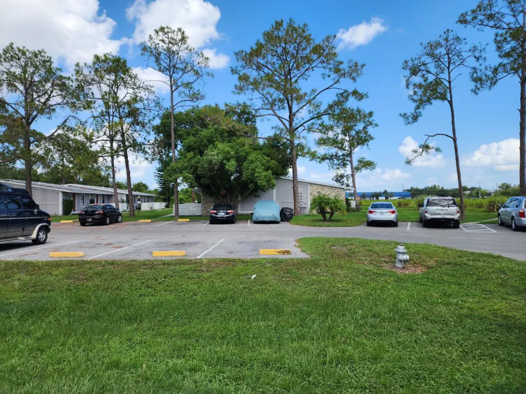 Resident parking and green space at Heatherwood Apartments